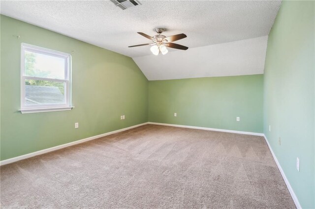 205 Stonehaven Dr, Belle Chasse, LA 70037 - bonus room featuring carpet flooring, ceiling fan, a textured ceiling, and vaulted ceiling