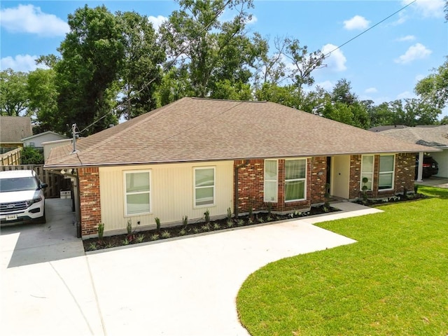 ranch-style house with a carport and a front yard