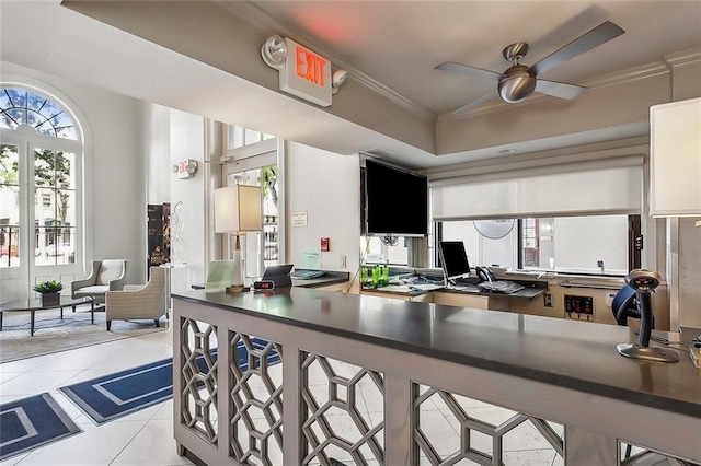 kitchen featuring white cabinets, crown molding, light tile patterned flooring, and ceiling fan