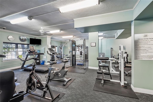 exercise room featuring a textured ceiling, ornamental molding, and ceiling fan