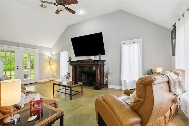 living room featuring light tile patterned floors, ceiling fan, and high vaulted ceiling