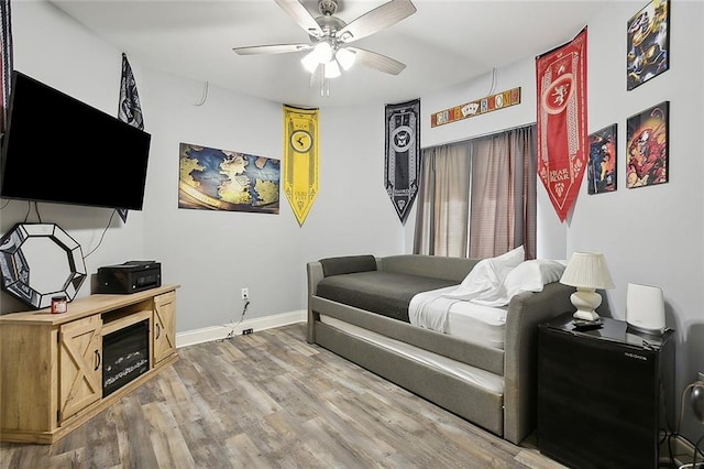 bedroom with wood-type flooring and ceiling fan