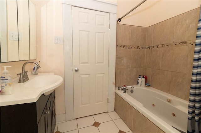 full bath with a combined bath / shower with jetted tub, vanity, and tile patterned floors