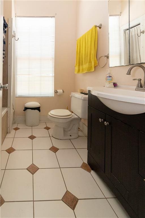 bathroom featuring curtained shower, toilet, vanity, tile patterned flooring, and a bath