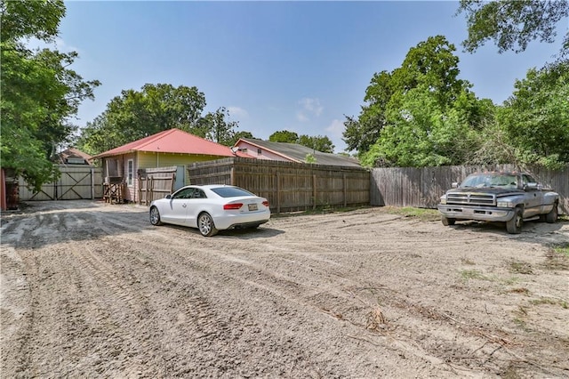 view of parking featuring fence