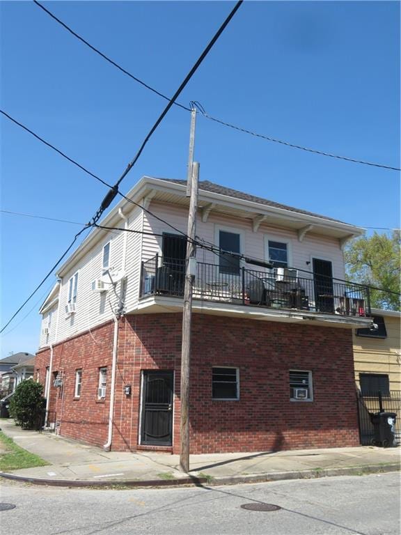 view of side of property with a balcony