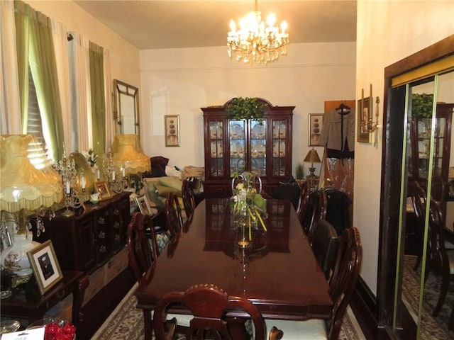 dining area featuring an inviting chandelier