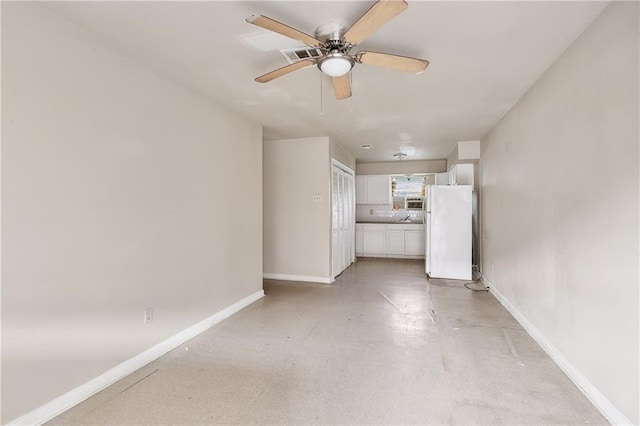 unfurnished living room featuring ceiling fan