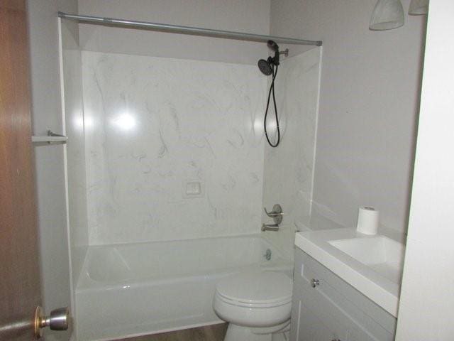 full bathroom with vanity, shower / bathtub combination, and toilet