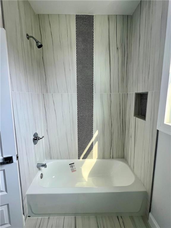 bathroom featuring tub / shower combination