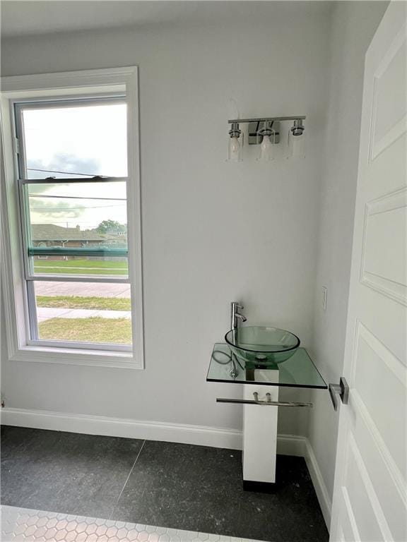 dining space with plenty of natural light and sink