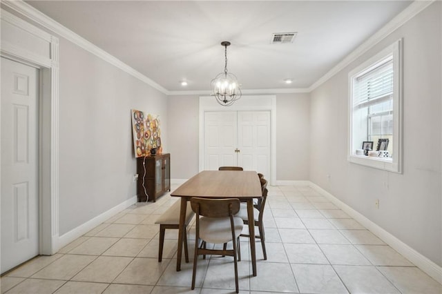 tiled dining area with an inviting chandelier and ornamental molding