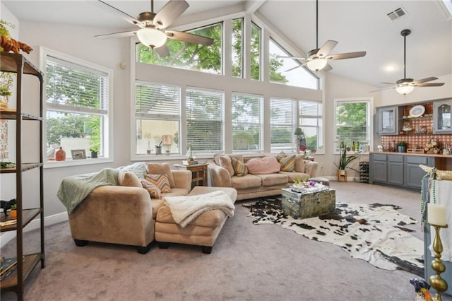 sunroom with a healthy amount of sunlight and lofted ceiling