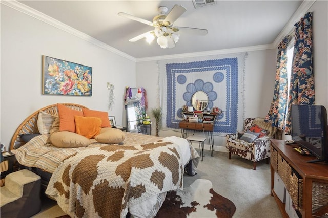 carpeted bedroom with ceiling fan and crown molding