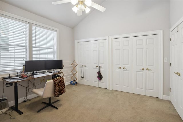 home office with ceiling fan, light carpet, and high vaulted ceiling