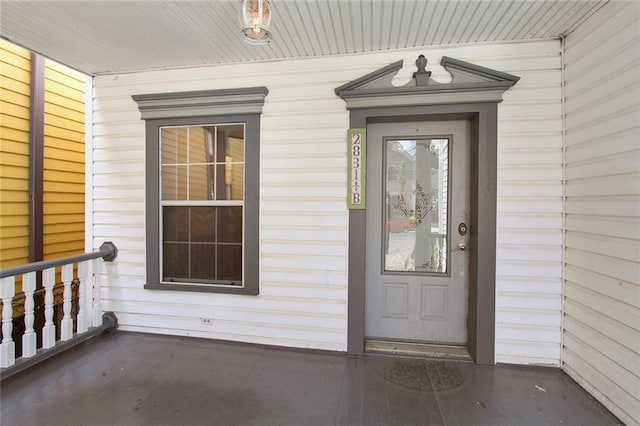 property entrance with covered porch