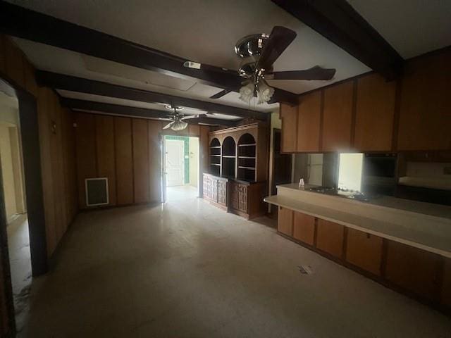 kitchen featuring beamed ceiling and ceiling fan