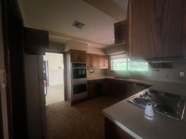 kitchen with sink, cooktop, and double oven