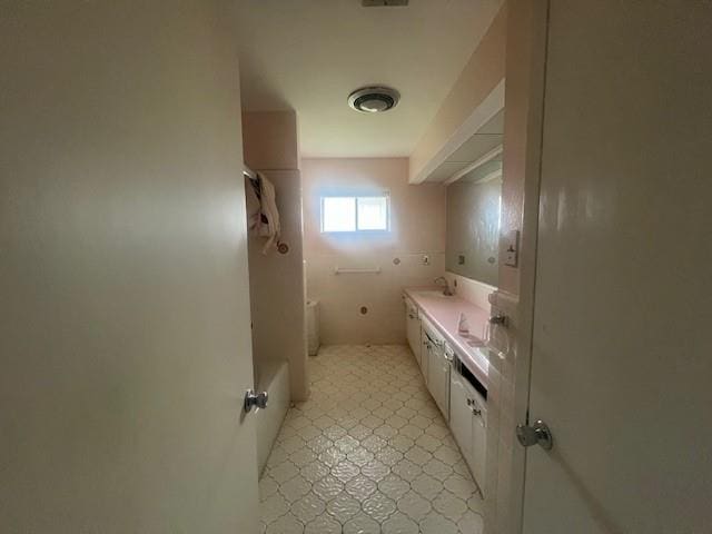 bathroom featuring double vanity and tile patterned floors