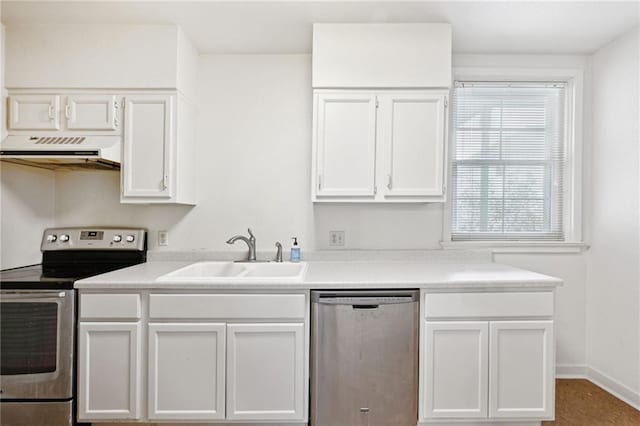 kitchen featuring appliances with stainless steel finishes, sink, white cabinetry, and range hood