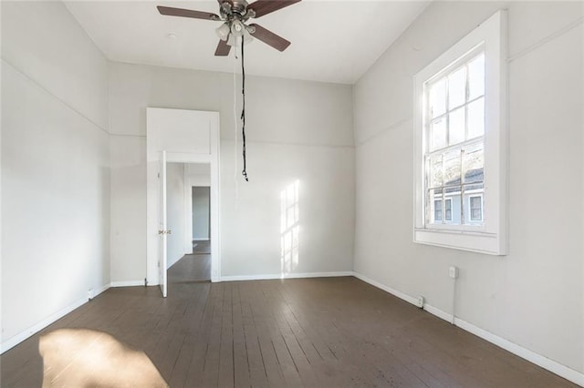 empty room with ceiling fan and hardwood / wood-style flooring