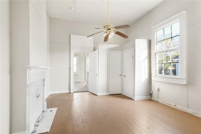 unfurnished bedroom featuring ceiling fan and light wood-type flooring