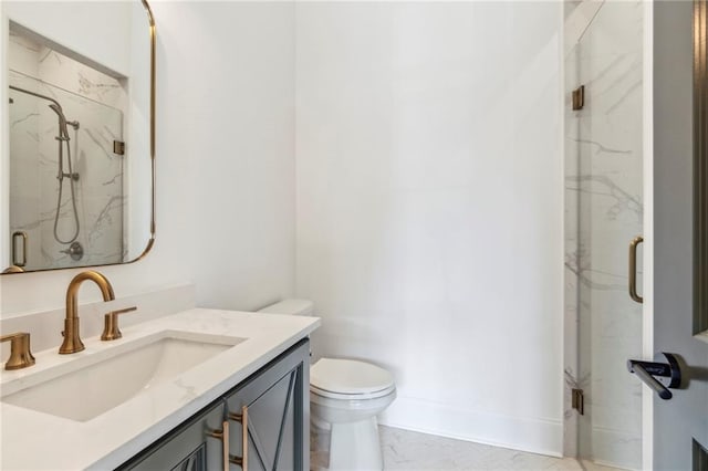 bathroom with a shower with shower door, vanity, tile patterned floors, and toilet