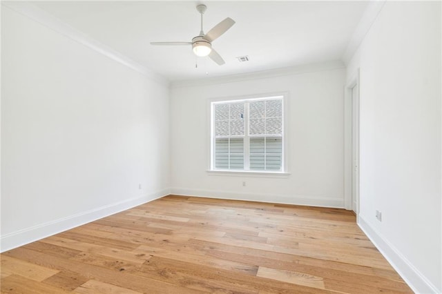 unfurnished room with ceiling fan, light hardwood / wood-style floors, and ornamental molding