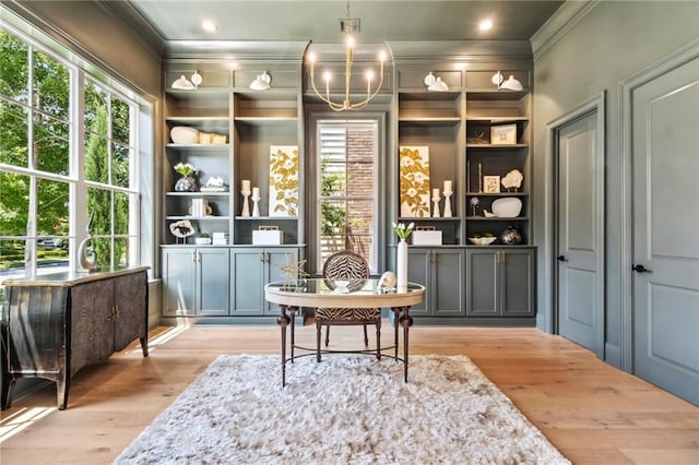 interior space with light hardwood / wood-style flooring and an inviting chandelier