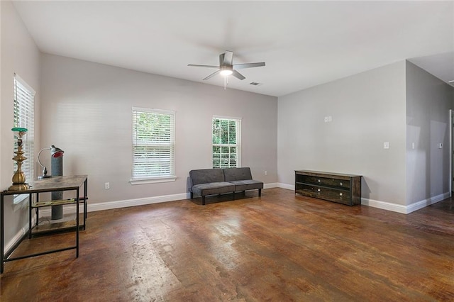 living area featuring dark hardwood / wood-style floors and ceiling fan