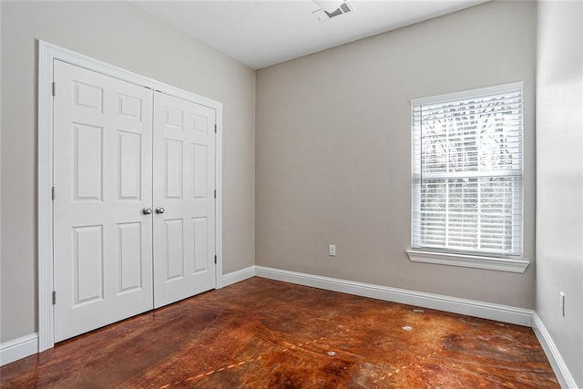 unfurnished bedroom with a closet