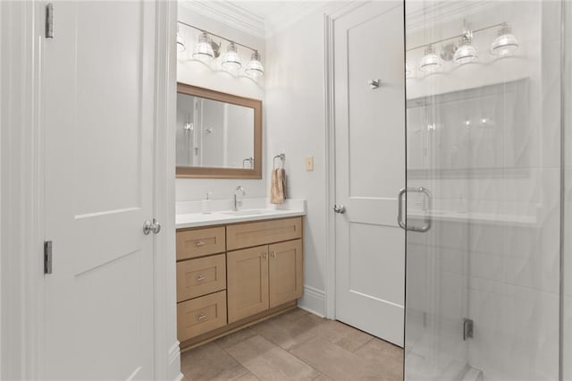 bathroom with ornamental molding, a stall shower, and vanity