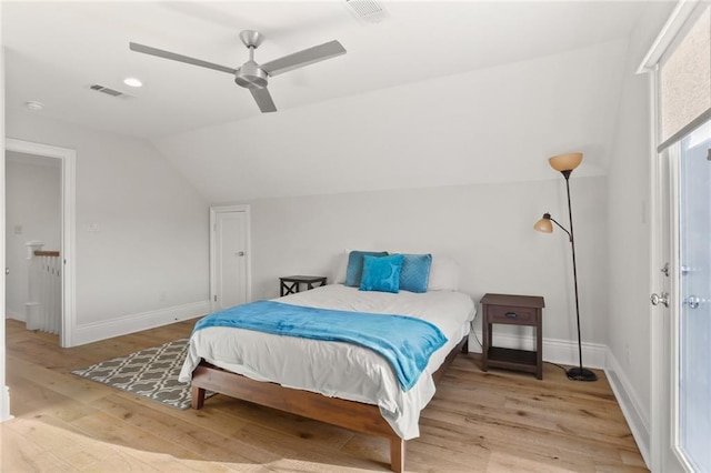 bedroom featuring vaulted ceiling, light wood-type flooring, and ceiling fan