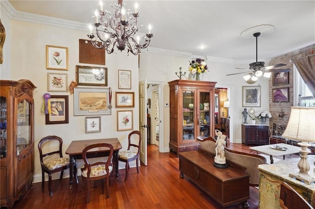 sitting room with ceiling fan with notable chandelier, dark hardwood / wood-style floors, and crown molding