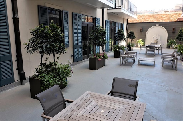 view of patio with a balcony