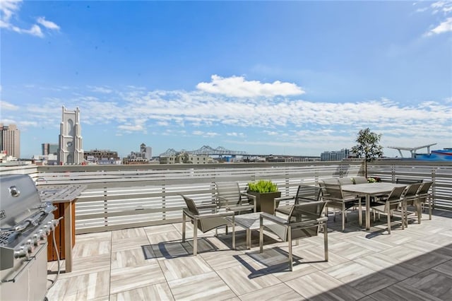 wooden terrace featuring grilling area