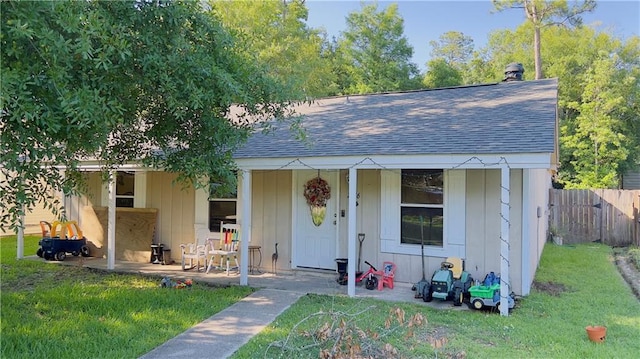 view of outbuilding with a yard