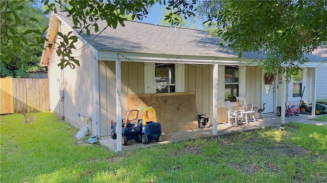 view of outbuilding featuring a lawn