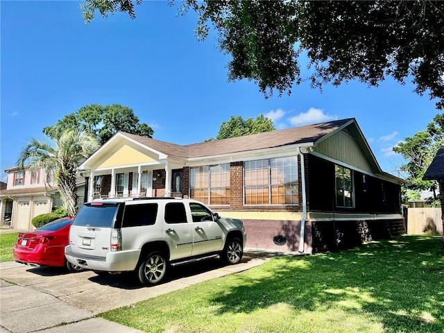 single story home with a front yard