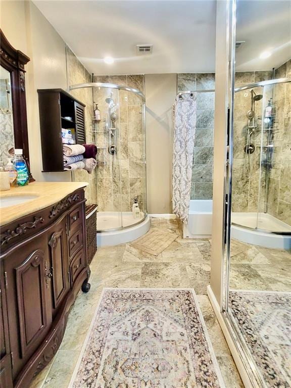 bathroom with walk in shower and vanity