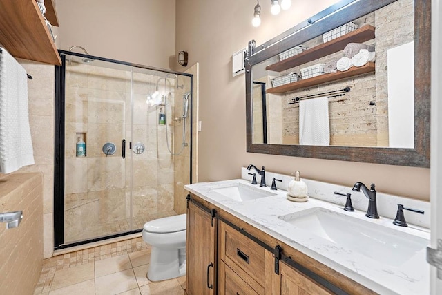 bathroom with walk in shower, tile floors, toilet, and dual bowl vanity