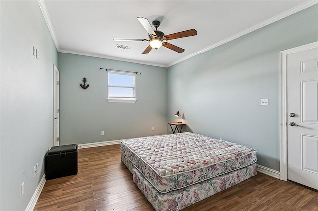 bedroom featuring ornamental molding, ceiling fan, and dark wood-type flooring