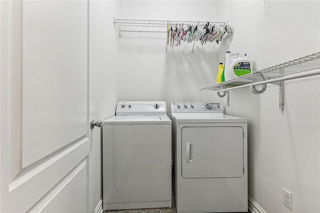 clothes washing area featuring washing machine and dryer