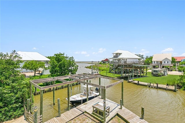 dock area with a yard and a water view