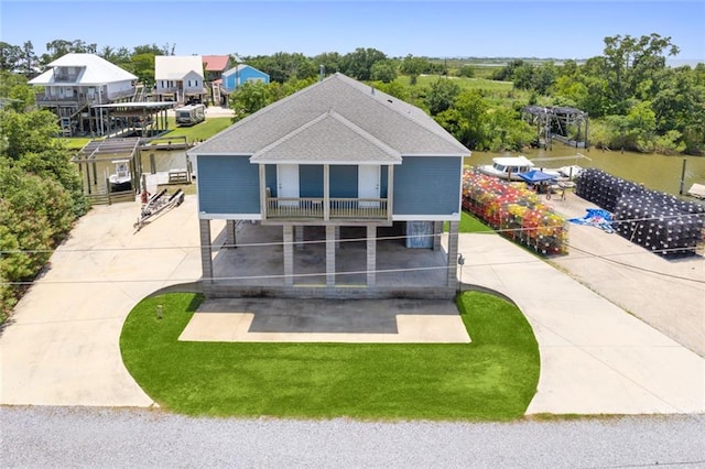 exterior space featuring a water view and a balcony