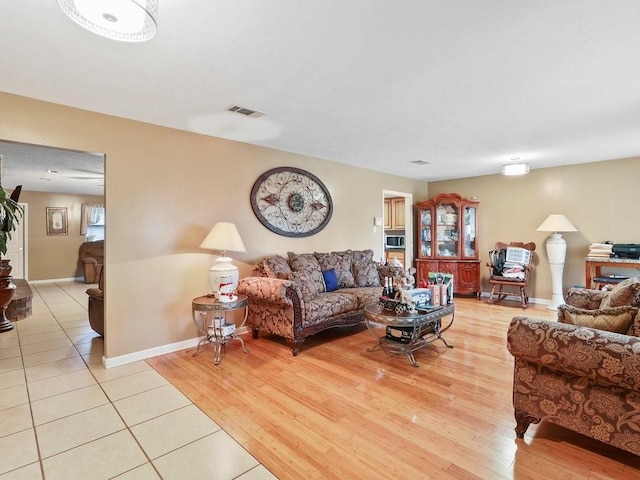 living room with light hardwood / wood-style flooring