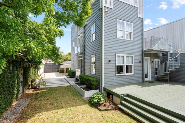 back of property with a wooden deck