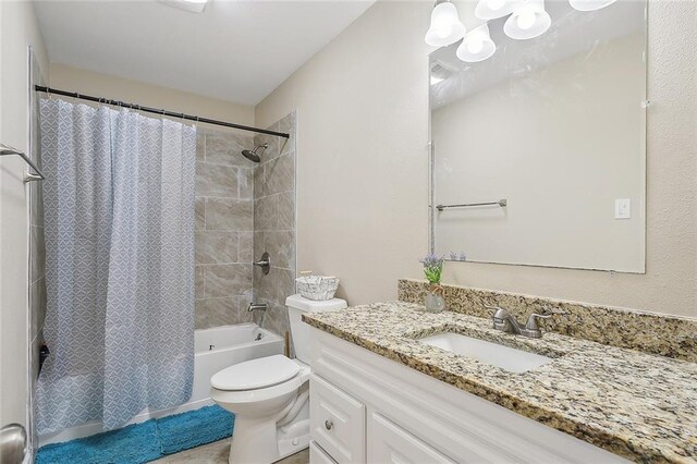 full bathroom with shower / bathtub combination with curtain, oversized vanity, and toilet