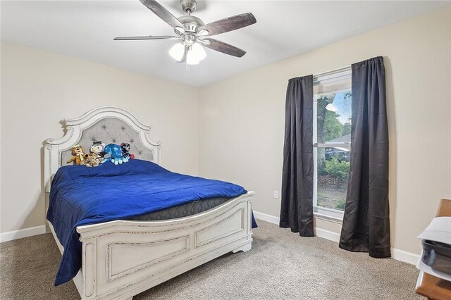 bedroom featuring ceiling fan and carpet floors