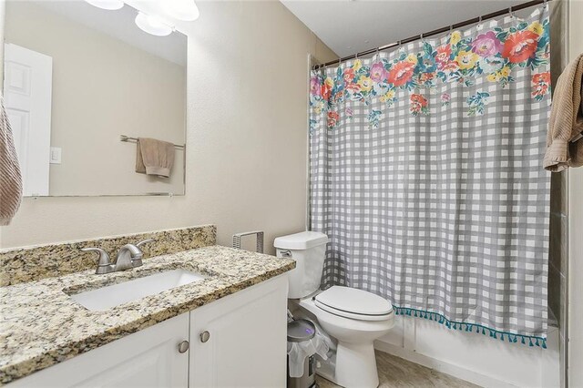 full bathroom featuring oversized vanity, toilet, and shower / bath combination with curtain